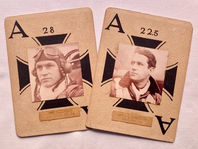 two playing cards with a picture of a man and a woman on them