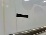 a sticker on the side of a refrigerator door