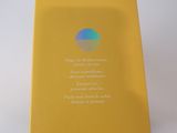 packaging of a yellow box with a picture of an apple logo on it