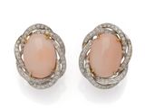 a pair of coral and diamond earrings