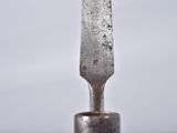 a knife stuck in the middle of a fork