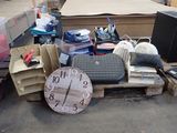 a large clock sitting on top of a pile of junk