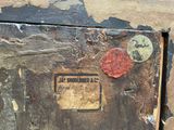 a close up of a piece of wood with a sign on it