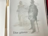 two books that are open to show a drawing of a man
