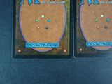 two cards with different designs on them sitting on a table