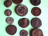 a lot of coins that are on a green surface