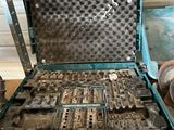 a tool case with tools inside of it on the floor