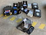 several pieces of luggage sitting on the ground next to a parking lot