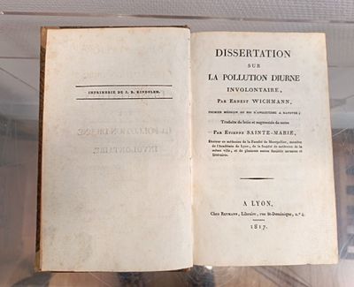 an open book on display in a glass case