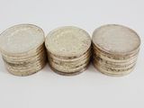 three stacks of coins sitting on top of each other