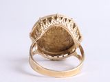 an image of a close up of a gold ring on a white surface