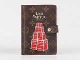 louis vuitton passport case with a pyramid design on the front