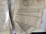 a pile of old papers sitting on top of a table