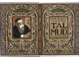 un vieux livre sur lequel figure l'image d'un homme barbu