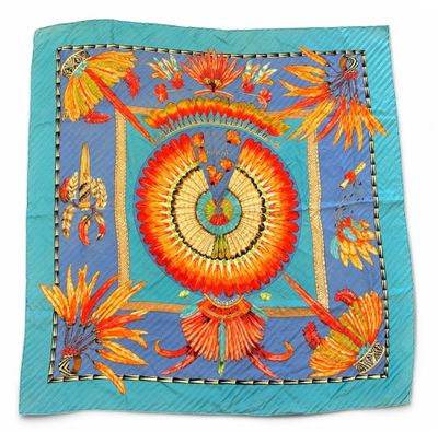 an image of a blue and orange scarf with a bird on it