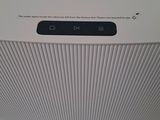 a white air purifier sitting on top of a white counter