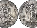a close up of a silver coin with a man on it