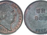 a close up of a coin with the word un sou on it