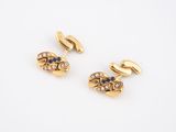 a pair of gold and sapphire cufflinks