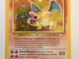 a close up of a pokemon card on a white surface