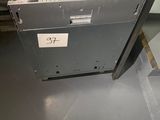 a metal cabinet with a label on it in a room