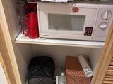 a microwave and a microwave oven in a cabinet