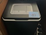 a black and white printer sitting in a drawer