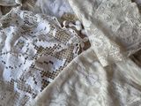 a pile of white lace on a table