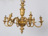 a gold colored chandelier hanging from the ceiling