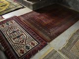 several rugs are laid out on the floor in a room