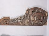 two pieces of wood that have been carved into the shape of a snail