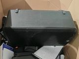 a suitcase and other items in a box on the floor