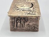 an antique silver box with an image of a man and a woman