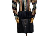 a mannequin wearing a black skirt and a multicolored shirt
