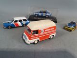 three toy cars that are sitting next to each other on a table