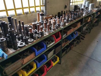 many different types of tools on the shelves