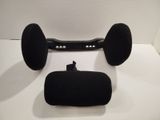 a black speaker and a black case on a white surface