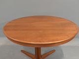 an image of a round table with a wooden top