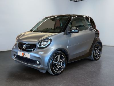 the smart car is parked in the showroom in the showroom