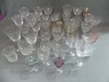 a lot of wine glasses sitting on a table