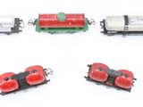 four toy train cars with ladybugs on them on a white surface