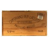 a wooden box with a label on it on a white background