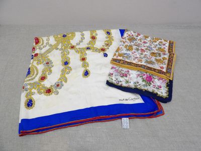 two pieces of white and blue embroidered sari with blue border
