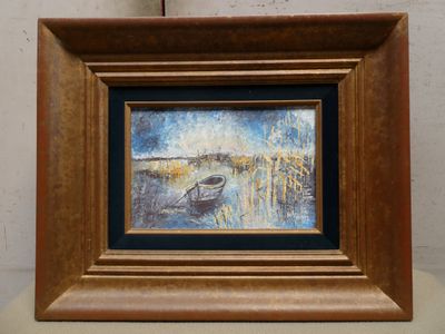 a picture of a painting of a boat on a table
