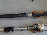 two chainsaws that are laying on the floor