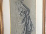 framed drawing of a man in a robe by a fireplace