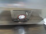 an image of a stainless steel counter top with a red circle on it
