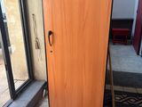 a refrigerator that is sitting in front of a window