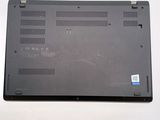 a black laptop with a blue sticker on it