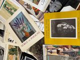 a lot of books on the floor with pictures on them